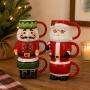 SET TAZAS NAVIDEÑAS DISPONIBLE EN 2 DISEÑOS SANTA / CASCANUECES CERÁMICA 3 PIEZAS